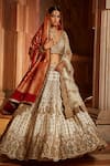 Buy_Nitika Gujral_Cream Taffeta Embroidered Zardozi Plunge V Neck Intricate Bridal Lehenga Set _at_Aza_Fashions