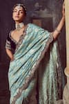 Nitika Gujral_Green Saree: Monga Banarsi Silk Floral Woven With Velvet Blouse For Women_at_Aza_Fashions