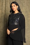 Shop_Bump Loving_Black Net Hand Embroidered Sequin Work Round Shoulder Drape Jumpsuit  _Online_at_Aza_Fashions