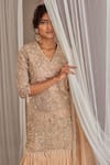 Nidhika Shekhar_Beige Georgette Hand Embroidered Sequins V Neck Ruffle Lehenga Kurta Set _at_Aza_Fashions