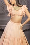 Izzumi Mehta Peach Korean Crepe V Neck Embroidered Blouse And Tiered Lehenga Set Online at Aza Fashions Izzumi Mehta_Peach Korean Crepe V Neck Embroidered Blouse And Tiered Lehenga Set _Online_at_Aza_Fashions