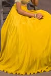 Shop Izzumi Mehta Yellow Net, Korean Crepe One Shoulder Embroidered Off Blouse And Lehenga Set at Aza Fashions Shop_Izzumi Mehta_Yellow Net, Korean Crepe One Shoulder Embroidered Off Blouse And Lehenga Set _at_Aza_Fashions