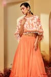 Priyaa_Orange Georgette Tie And Dye Floral Tiered Lehenga Set With Cape _Online_at_Aza_Fashions