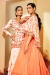 Buy_Priyaa_Orange Georgette Tie And Dye Floral Tiered Lehenga Set With Cape _Online_at_Aza_Fashions