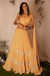 Buy_Nirmooha_Yellow Georgette Embroidered Sequin V Neck Draped Blouse And Lehenga Set _at_Aza_Fashions