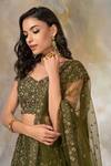 Pooja Peshoria_Green Raw Silk Sweetheart Neck Embellished Bridal Lehenga Set _at_Aza_Fashions