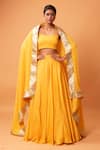 Buy_Quench A Thirst_Yellow Modal Silk Plain Scoop Neck Lehenga Set With Border Embroidered Dupatta _at_Aza_Fashions