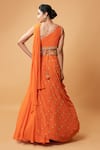 Shop_Quench A Thirst_Orange Georgette Embellished Cutdana V Neck Draped Lehenga And Blouse Set _at_Aza_Fashions