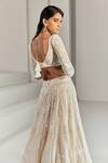 Shop Ritika Mirchandani White Net Embroidered Wed Design V Neck Paola Bridal Lehenga Set at Aza Fashions Shop_Ritika Mirchandani_White Net Embroidered Wed Design V Neck Paola Bridal Lehenga Set _at_Aza_Fashions