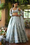 Reynu Taandon_Blue Net V Neck Iris Bridal Lehenga Set_Online_at_Aza_Fashions