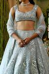 Reynu Taandon_Blue Net V Neck Iris Bridal Lehenga Set_at_Aza_Fashions
