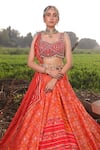 Aditi Gupta_Orange Lehenga Handwoven Banarasi Blouse Pure Silk Dupatta Ikat Set _at_Aza_Fashions