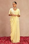 Buy_Samatvam by Anjali Bhaskar_Yellow Blended Georgette Embroidered Mirror Work V Pre-draped Saree With Peplum_at_Aza_Fashions