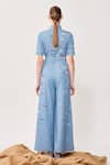 Shop Shahin Mannan Blue Denim Typography Shirt Collar Embroidered Jumpsuit With Belt at Aza Fashions Shop_Shahin Mannan_Blue Denim Typography Shirt Collar Embroidered Jumpsuit With Belt _at_Aza_Fashions