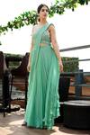 Surabhi Arya_Green Georgette Square Neck Pre-draped Saree With Blouse_Online_at_Aza_Fashions