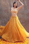 Buy_Silky Bindra_Yellow Net Embroidered Mirror Scoop Neck Embellished Bridal Lehenga Set _at_Aza_Fashions