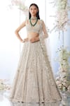 Buy_Seema Gujral_Beige Net Embroidered Sequin Plunge Floral Bridal Lehenga Set  _at_Aza_Fashions