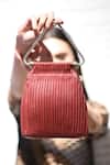 Shop Devina Juneja Red Triangle Pleated Clutch at Aza Fashions Shop_Devina Juneja_Red Triangle Pleated Clutch _at_Aza_Fashions