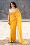 Shop_Soniya G_Yellow Organza Hand Embroidered Floral V Neck Printed Tassel Saree With Blouse _at_Aza_Fashions