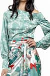 Shop_Mandira Wirk_Green Satin Printed Tropical Motifs One Shoulder Off Top And Wrap Skirt Set _Online_at_Aza_Fashions