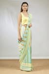 Vedika M_Green Satin Scoop Neck Stripe Print Saree With Blouse  _Online_at_Aza_Fashions