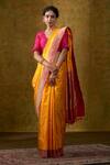 Buy Weaver Story Orange Handloom Katan Silk Banarasi Saree at Aza Fashions Buy_Weaver Story_Orange Handloom Katan Silk Banarasi Saree_at_Aza_Fashions