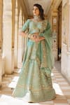 Buy_Surbhi Shah_Blue Pure Raw Silk Embroidered Floral Motifs V Neck Bridal Lehenga Set _at_Aza_Fashions