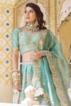 Surbhi Shah_Blue Pure Raw Silk Embroidered Floral Motifs V Neck Bridal Lehenga Set _Online_at_Aza_Fashions