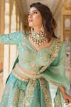 Buy_Surbhi Shah_Blue Pure Raw Silk Embroidered Floral Motifs V Neck Bridal Lehenga Set _Online_at_Aza_Fashions