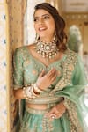 Surbhi Shah_Blue Pure Raw Silk Embroidered Floral Motifs V Neck Bridal Lehenga Set _at_Aza_Fashions