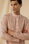 Buy_Philocaly_Peach Raw Silk Embroidered Mirror Work Comet Kurta _Online_at_Aza_Fashions