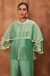 Jajobaa_Green Silk Organza Chinnon Round Overlay Ruffle Top And Flared Pant Set  _at_Aza_Fashions