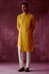 Buy_Pouli Pret_Yellow Cotton Satin Asymmetric Overlap Kurta _at_Aza_Fashions