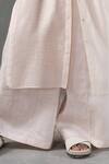 Urvashi Kaur_Peach Handwoven Silk Linen Flared Pant _Online_at_Aza_Fashions