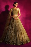 Buy_Vvani by Vani Vats_Gold Net Asymmetric Sequin Embroidered One Shoulder Lehenga Set _at_Aza_Fashions