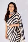 Shop_PUNIT BALANA_Black Satin Silk V Neck Striped Saree With Blouse_at_Aza_Fashions