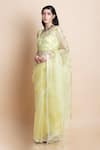 Buy_SAKSHAM & NEHARICKA_Yellow Silk Organza Saree  _at_Aza_Fashions