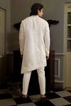 Shop Yajy By Aditya Jain White Kurta Silk, Pants Stretch Cotton Thread Dhwaja Set at Aza Fashions Shop_Yajy By Aditya Jain_White Kurta Silk, Pants Stretch Cotton Thread Dhwaja Set _at_Aza_Fashions