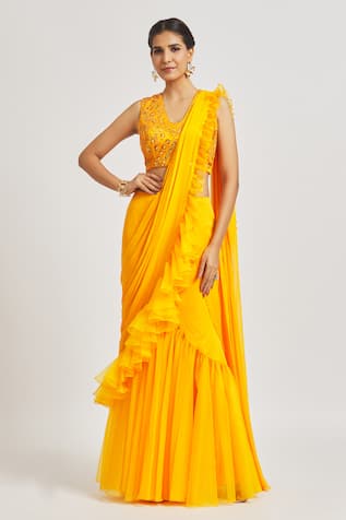 Elegant Sarees Online Store - Our Retro Summer Love is a surefire winner 🌻  Retro summer love ruffle saree is finely made with floral yellow chiffon  paired with a sassy looking chiffon