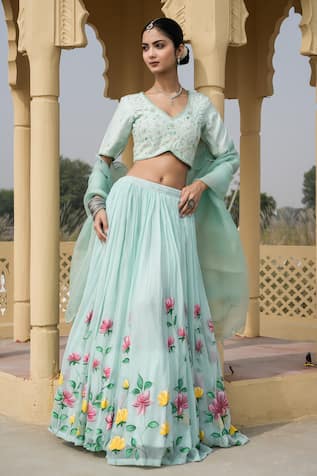 Weaver Story Silk Bageecha Banarasi Lehenga Set | Purple, Floral, Pure  Silk, V Neck, Short | Mehendi outfits, Banarasi lehenga, Fashion cotton  dresses