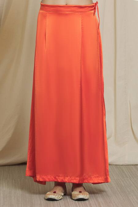 Divya Kanakia_Orange Satin, Organza Sequins V-neck Applique Embroidered Saree With Blouse _at_Aza_Fashions