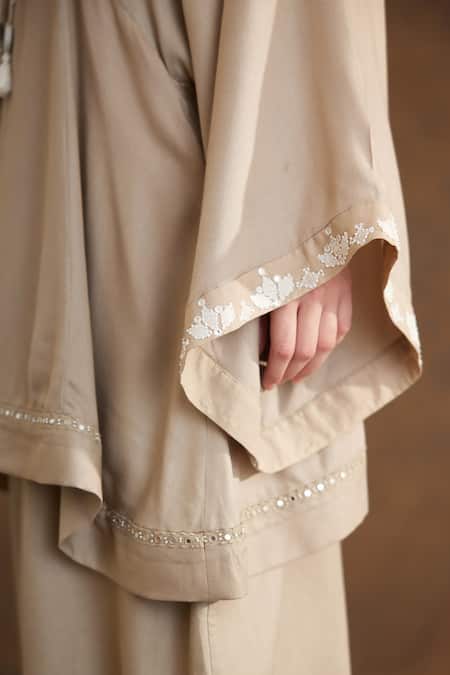 Nikasha Beige Rayon Beads, Embroidery V-neck Yoke Kaftan Top And Baggy Pant Set at Aza Fashions Nikasha_Beige Rayon Beads, Embroidery V-neck Yoke Kaftan Top And Baggy Pant Set _at_Aza_Fashions