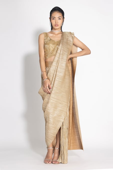 Tarun Tahiliani - Making a bold statement, @farhanabodi wears a metallic  jersey gold concept saree at Cannes 2019 with a jewelled print bodice  highlighted with diamonds, crystals and studs from our SS'19
