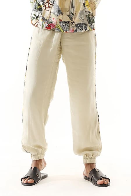 Mahima Mahajan Ivory Organza Side Tape Detail Joggers Online at Aza Fashions Mahima Mahajan_Ivory Organza Side Tape Detail Joggers _Online_at_Aza_Fashions