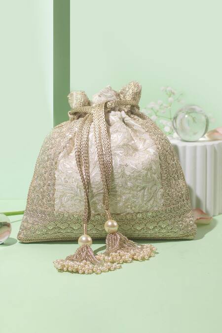 Buy Amyra Off White Embroidery, Tassels Inaya Thread And Zari Potli Bag at Aza Fashions Buy_Amyra_Off White Embroidery, Tassels Inaya Thread And Zari Potli Bag_at_Aza_Fashions