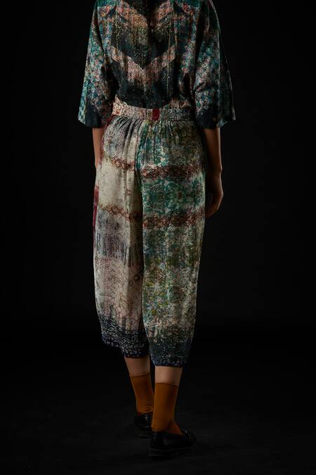 Shop Yavi Ivory Viscose Crepe Impressionist Print Carmen Wide Leg Pants at Aza Fashions Shop_Yavi_Ivory Viscose Crepe Impressionist Print Carmen Wide Leg Pants_at_Aza_Fashions