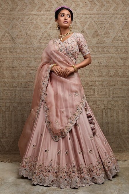 Onion Pink lehenga with embroidered blouse and cape.