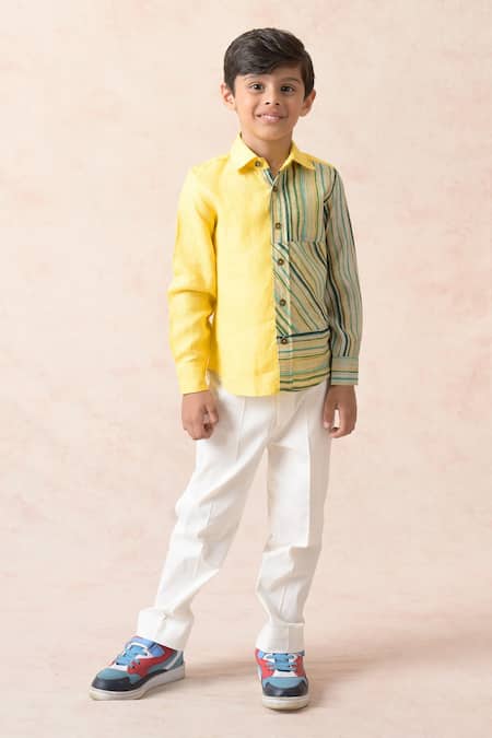 Premium Photo | Side view of a walking boy in a yellow tracksuit with a  hood and trousers white sneakers isolated on white portrait of a child in  cool clothes kids fashion