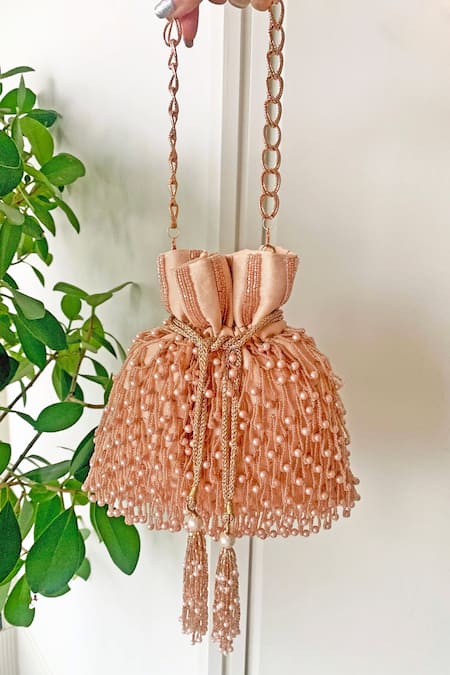 Shop_Essemm_Peach Embellished Wink Pearl Potli _at_Aza_Fashions