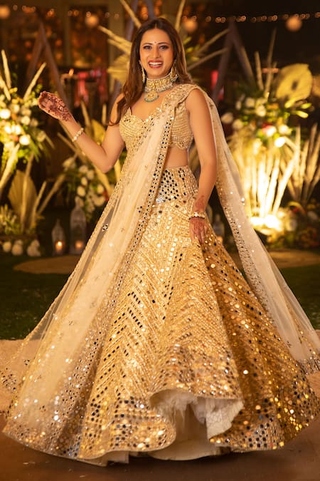 This bride wore a dull gold lehenga with corset for her wedding reception -  Times of India